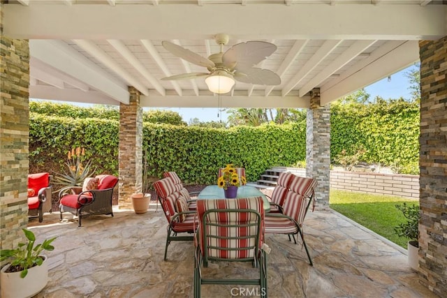 view of patio / terrace with a ceiling fan and outdoor dining area