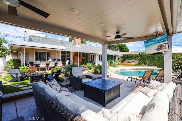 view of patio / terrace featuring a fenced in pool, ceiling fan, an outdoor hangout area, and outdoor dining space
