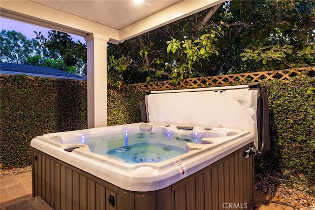 exterior space featuring a hot tub
