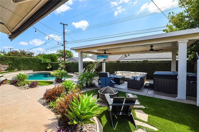 view of patio / terrace with ceiling fan, an outdoor living space with a fire pit, a fenced backyard, a fenced in pool, and a hot tub