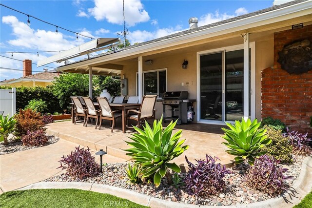 17892 Wellington Ave, North Tustin, CA 92780 - view of patio with a grill, outdoor dining area, and fence