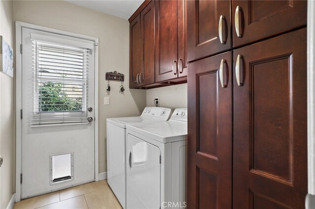 17892 Wellington Ave, North Tustin, CA 92780 - laundry area with cabinet space, washer and dryer, baseboards, and light tile patterned floors