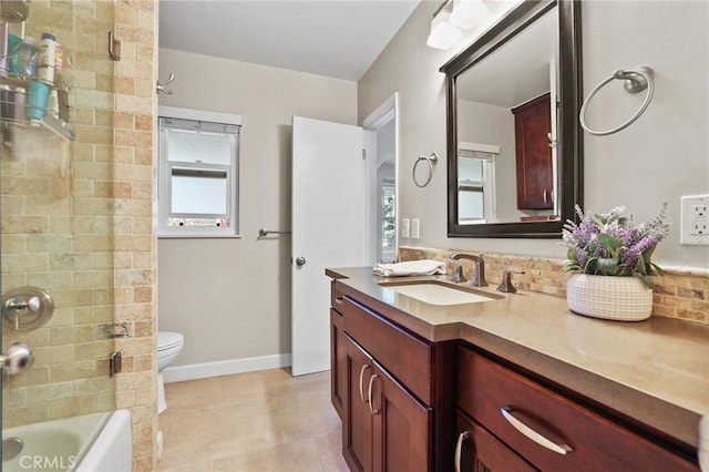 bathroom featuring vanity, tile patterned flooring, toilet, and bathing tub / shower combination