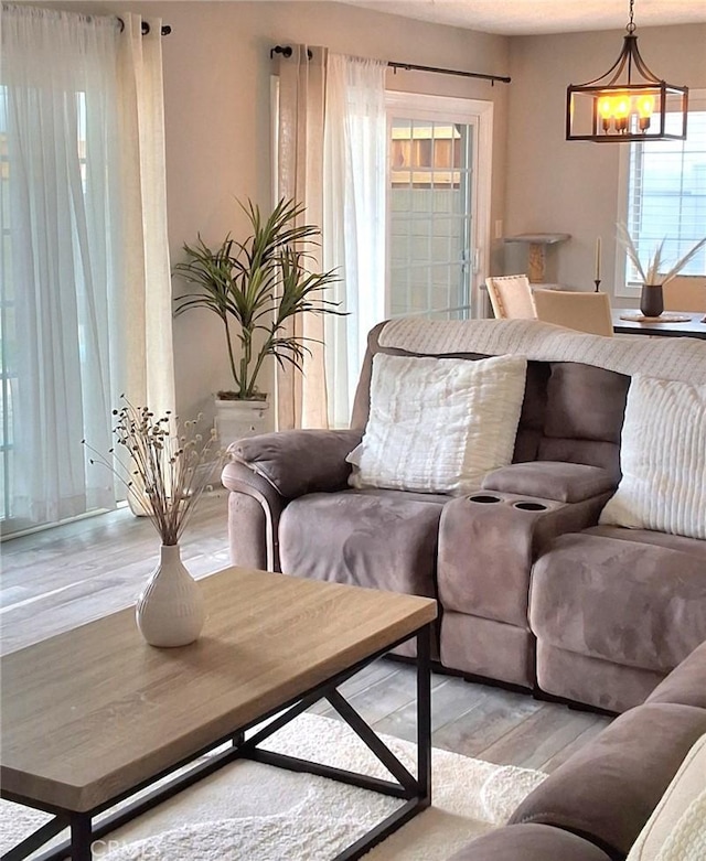 6151 Tyndall Dr, Huntington Beach, CA 92647 - living area featuring light wood finished floors and a chandelier