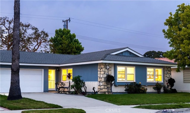 6151 Tyndall Dr, Huntington Beach, CA 92647 - ranch-style house featuring concrete driveway, stone siding, an attached garage, and a front yard