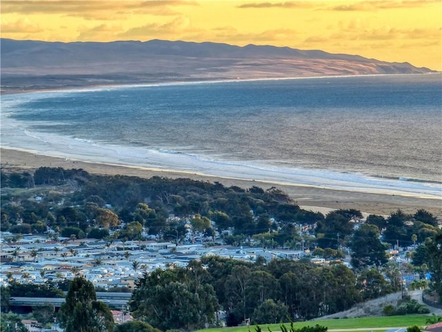 view of water feature with a view of the beach and a mountain view
