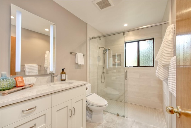 full bathroom featuring a shower stall, tile patterned flooring, visible vents, toilet, and vanity