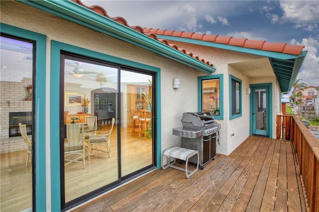 wooden deck featuring area for grilling
