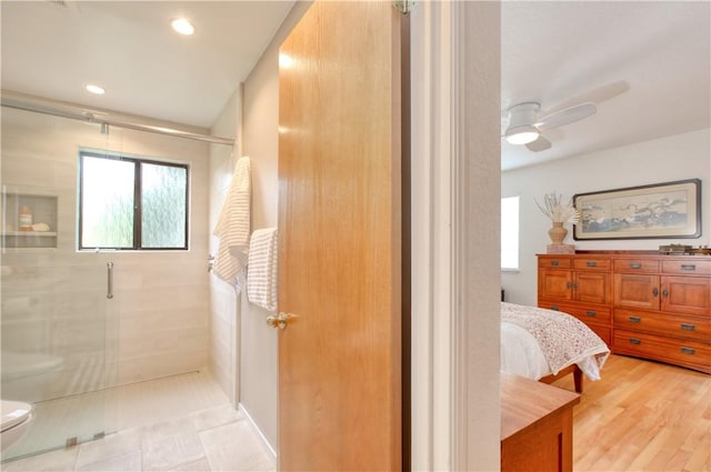 full bathroom with plenty of natural light, a shower stall, and toilet