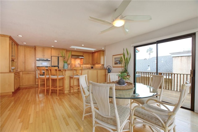 dining room with ceiling fan, recessed lighting, and light wood-style flooring