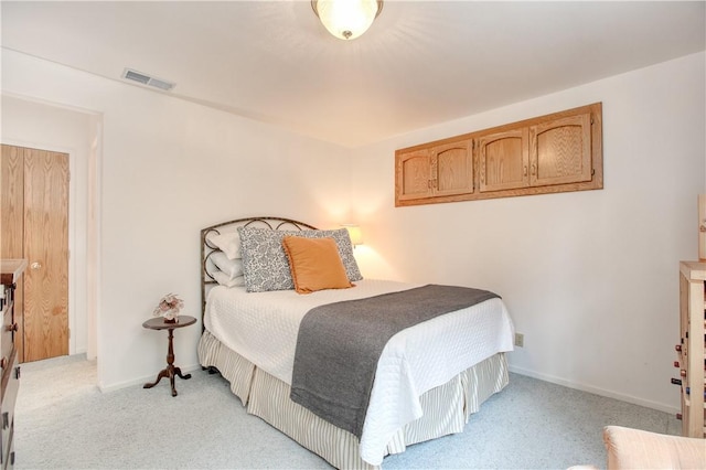 bedroom featuring light carpet, baseboards, and visible vents