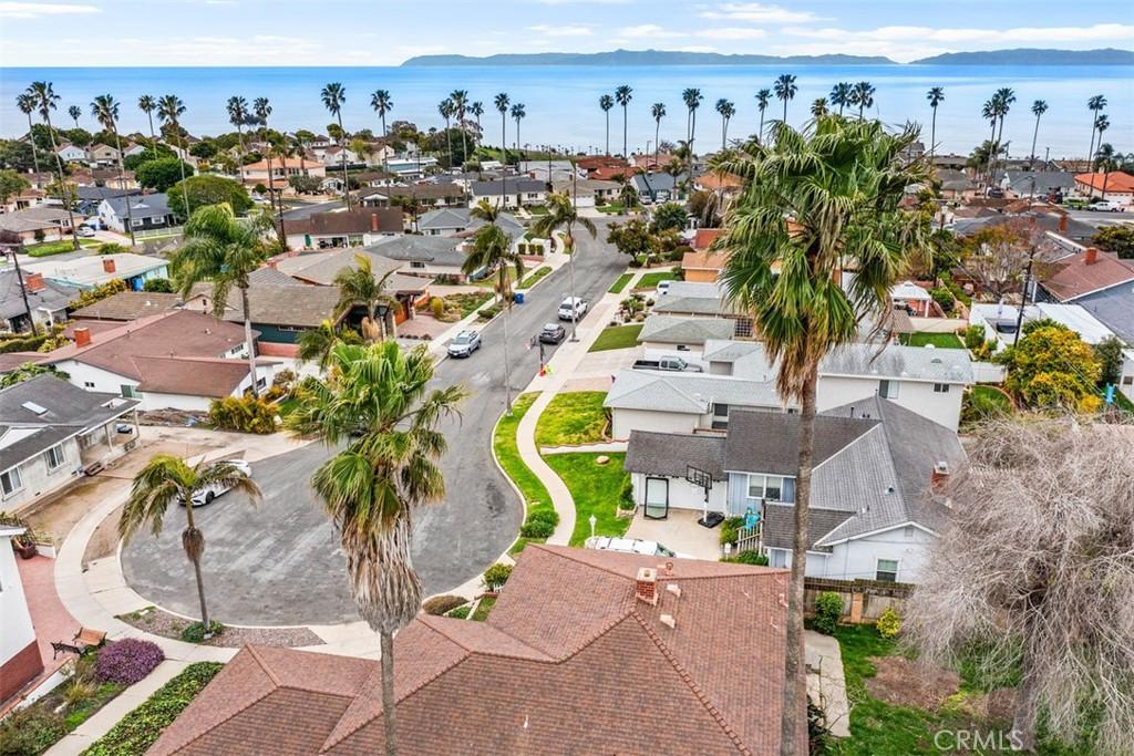 drone / aerial view with a residential view and a water view