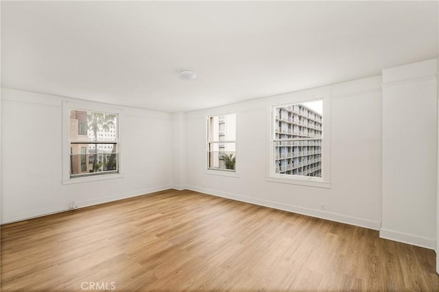 455 E Ocean Blvd Unit 411, Long Beach, CA 90802 - unfurnished room with light wood-style flooring and baseboards
