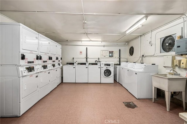 455 E Ocean Blvd Unit 411, Long Beach, CA 90802 - communal laundry room with washer and dryer, stacked washing machine and dryer, light floors, and electric panel