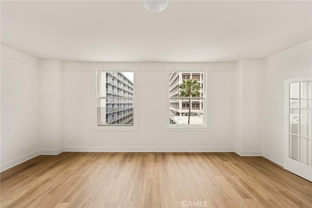 455 E Ocean Blvd Unit 411, Long Beach, CA 90802 - spare room featuring light wood-type flooring and baseboards