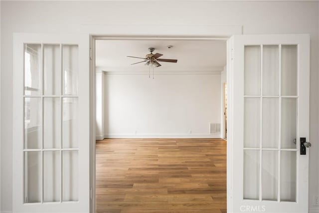 455 E Ocean Blvd Unit 411, Long Beach, CA 90802 - spare room featuring wood finished floors, a ceiling fan, and baseboards
