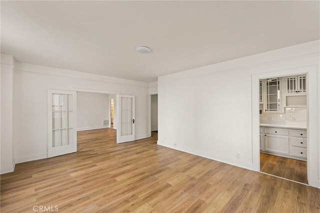 455 E Ocean Blvd Unit 411, Long Beach, CA 90802 - spare room featuring light wood-style flooring and baseboards