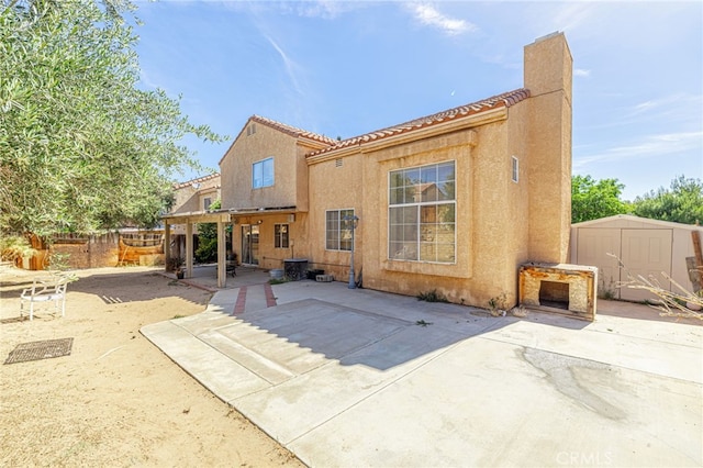 36849 James Pl, Palmdale, CA 93550 - back of property featuring a patio, stucco siding, and a chimney