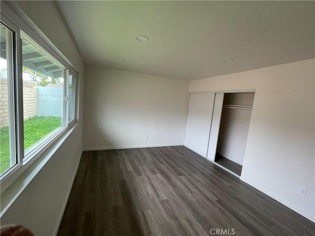 13749 Dahl Way, Moreno Valley, CA 92553 - unfurnished bedroom featuring baseboards, dark wood-style flooring, and a closet