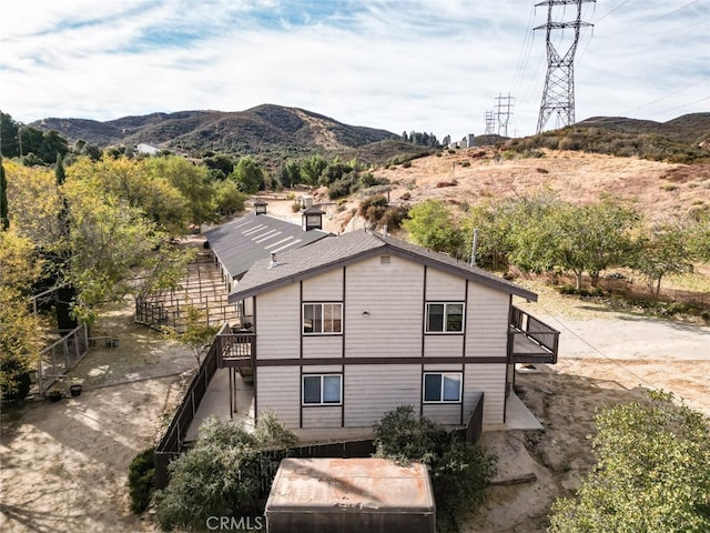 42135 San Francisquito Canyon Rd, Green Valley, CA 91390 - rear view of house featuring a mountain view and stairway
