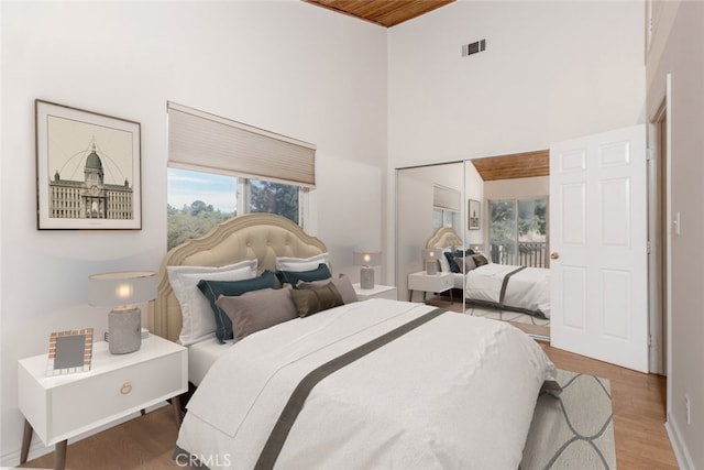 42135 San Francisquito Canyon Rd, Green Valley, CA 91390 - bedroom with a high ceiling, wood finished floors, and baseboards