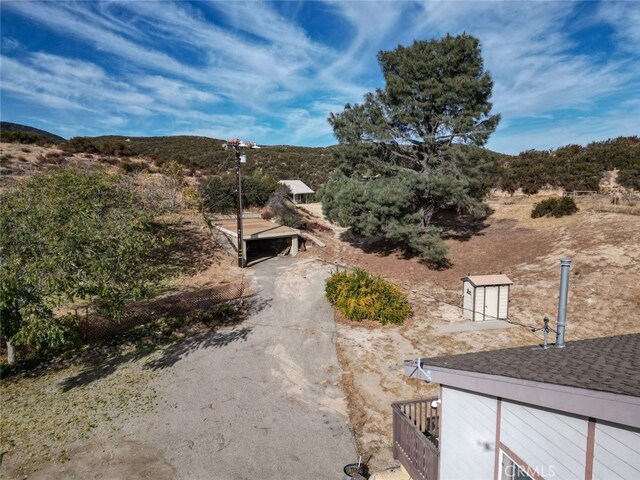42135 San Francisquito Canyon Rd, Green Valley, CA 91390 - view of yard featuring an outbuilding, a shed, and a mountain view