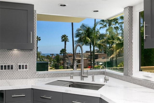 33961 Granada Dr, Dana Point, CA 92629 - kitchen featuring gray cabinets, light countertops, decorative backsplash, healthy amount of natural light, and recessed lighting