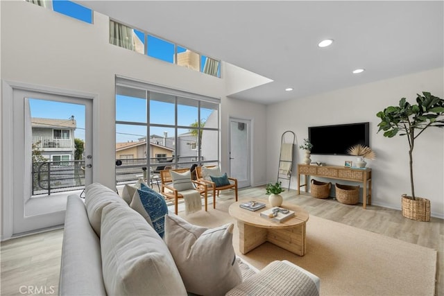 715 3rd St, Hermosa Beach, CA 90254 - living room featuring recessed lighting, a healthy amount of sunlight, and light wood-type flooring