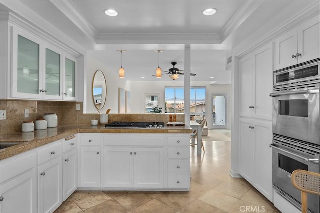 715 3rd St, Hermosa Beach, CA 90254 - kitchen featuring a peninsula, a raised ceiling, appliances with stainless steel finishes, and ceiling fan