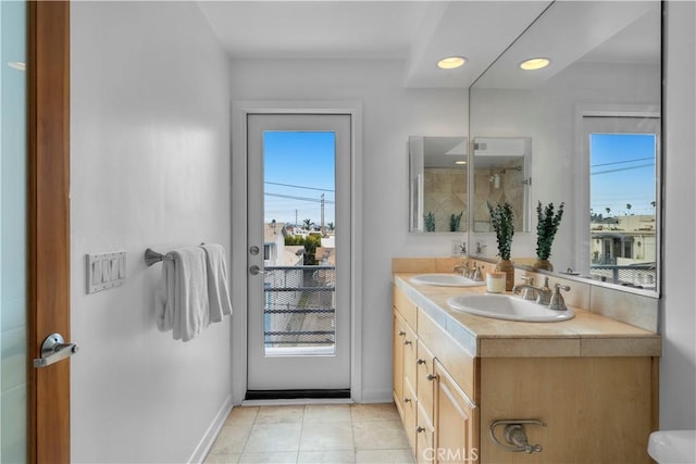 715 3rd St, Hermosa Beach, CA 90254 - full bath with baseboards, tile patterned floors, a sink, and double vanity