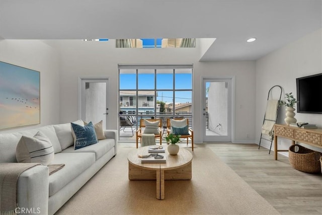 715 3rd St, Hermosa Beach, CA 90254 - living room with recessed lighting, wood finished floors, and baseboards