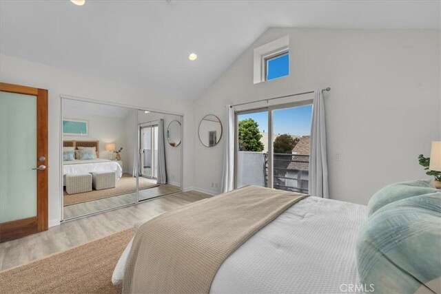 715 3rd St, Hermosa Beach, CA 90254 - bedroom with high vaulted ceiling, baseboards, access to outside, and wood finished floors