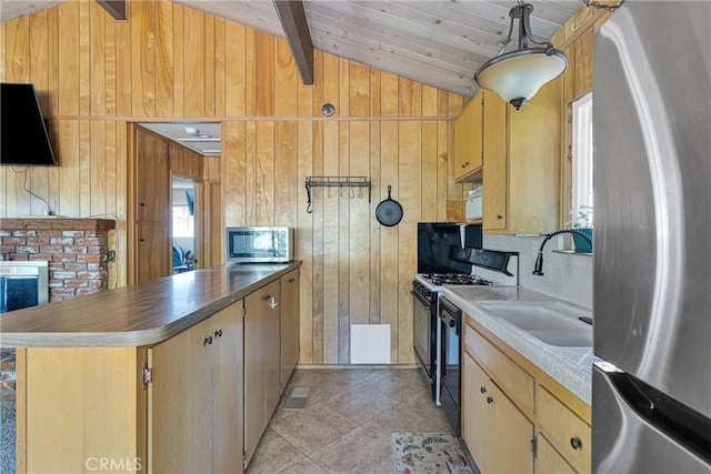 23660 Shady Ln, Crestline, CA 92325 - kitchen featuring stainless steel appliances, a sink, wood walls, light tile patterned flooring, and light brown cabinetry