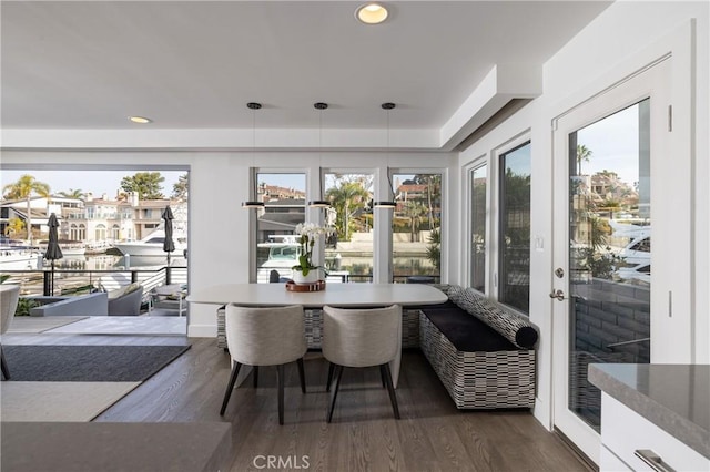 dining area with dark wood-style floors and recessed lighting