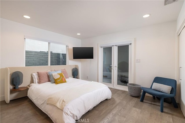 bedroom featuring access to outside, visible vents, recessed lighting, and light wood-style floors