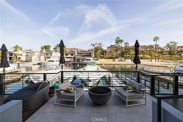 view of patio featuring a residential view, an outdoor hangout area, and a dock