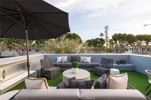 view of patio / terrace with a balcony and an outdoor hangout area