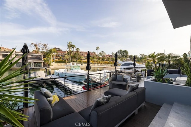 exterior space featuring an outdoor living space and a boat dock