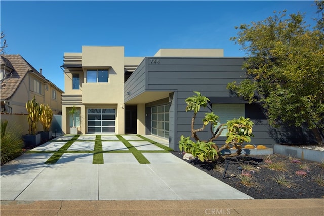 contemporary house featuring stucco siding