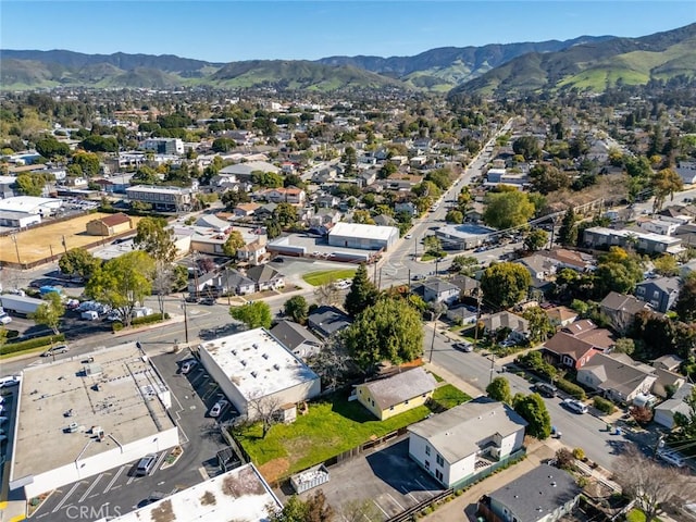 birds eye view of property with a mountain view and a residential view