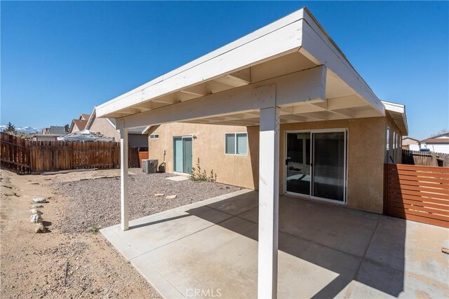 13625 Brynwood St, Victorville, CA 92392 - rear view of property featuring stucco siding, a patio area, and central AC unit