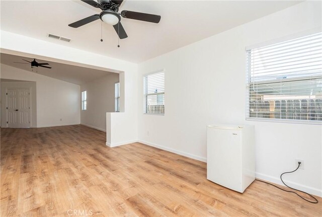 13625 Brynwood St, Victorville, CA 92392 - unfurnished room with light wood-style floors, a ceiling fan, and baseboards