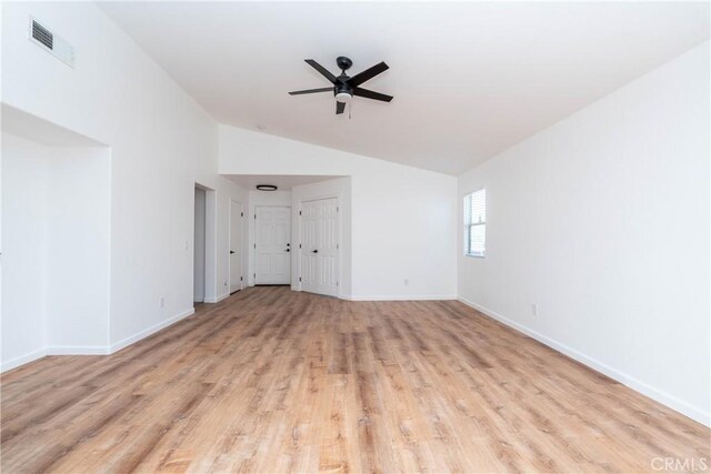 13625 Brynwood St, Victorville, CA 92392 - unfurnished room with vaulted ceiling, a ceiling fan, light wood-style floors, and baseboards
