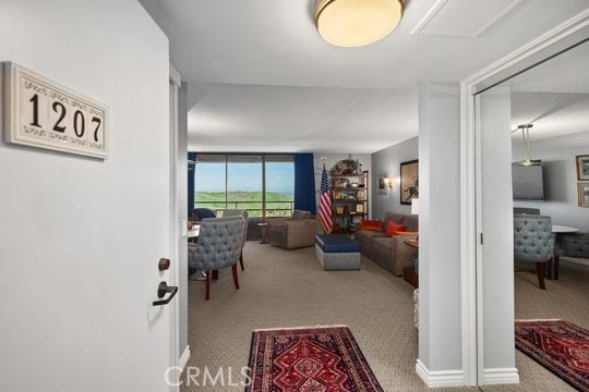 hallway featuring carpet flooring