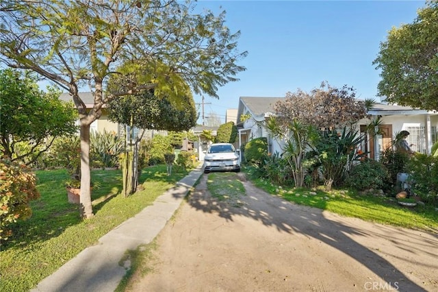 exterior space featuring driveway and stucco siding