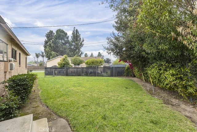 view of yard with a fenced backyard