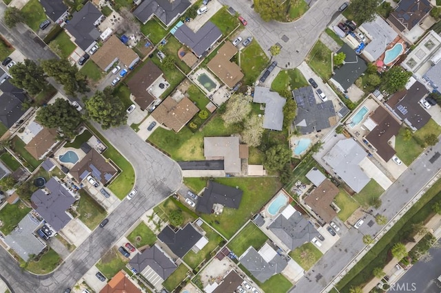 birds eye view of property with a residential view