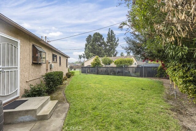 view of yard featuring fence