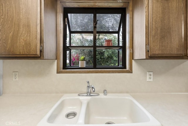 room details with light countertops and a sink