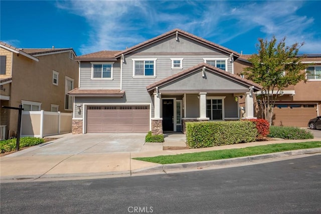 12241 Amaryllis, Yucaipa, CA 92399 - craftsman inspired home featuring covered porch, a garage, concrete driveway, and stone siding